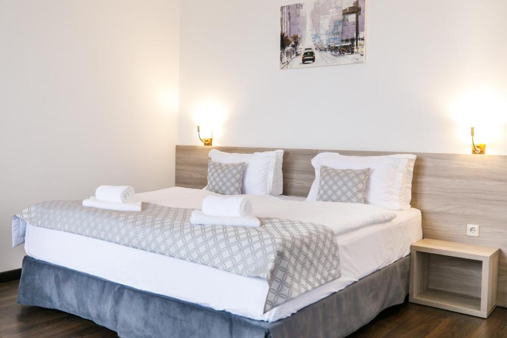 Postel nebo postele na pokoji v ubytování Hotel Antonio