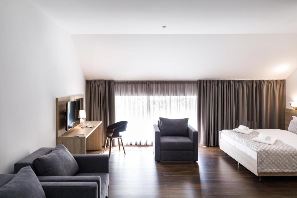 Postel nebo postele na pokoji v ubytování Hotel Antonio