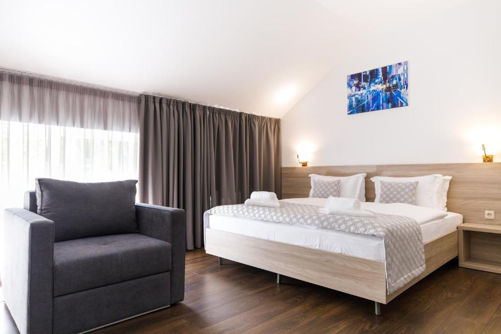 Postel nebo postele na pokoji v ubytování Hotel Antonio