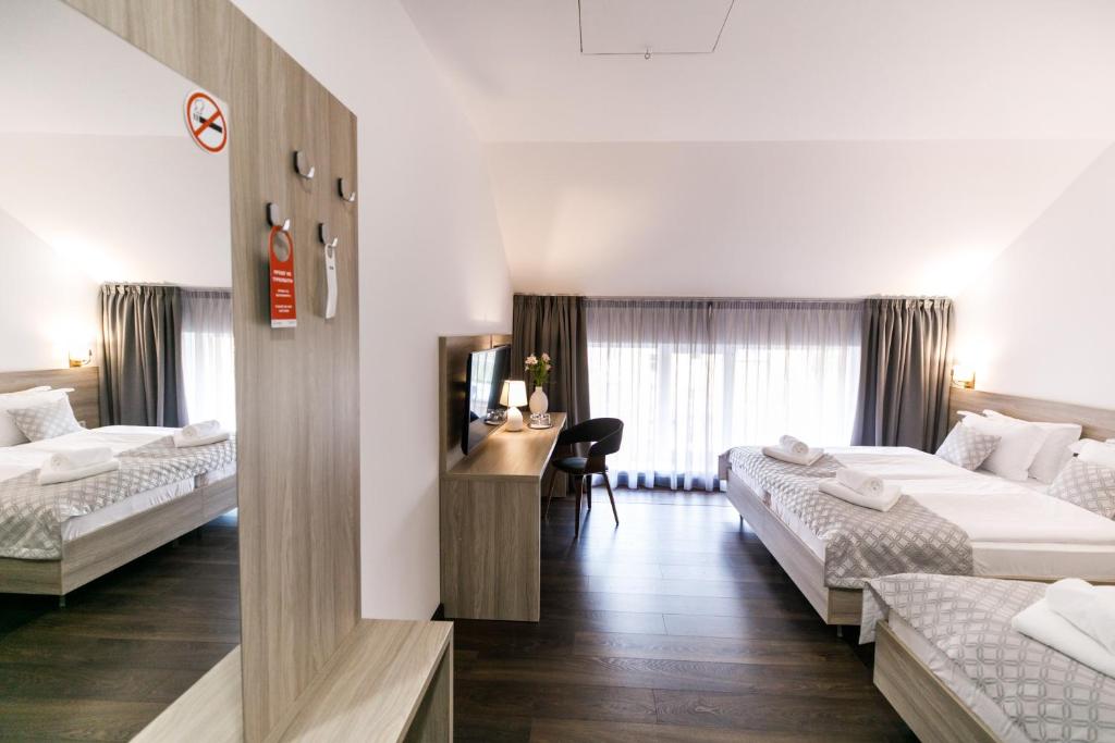 Postel nebo postele na pokoji v ubytování Hotel Antonio