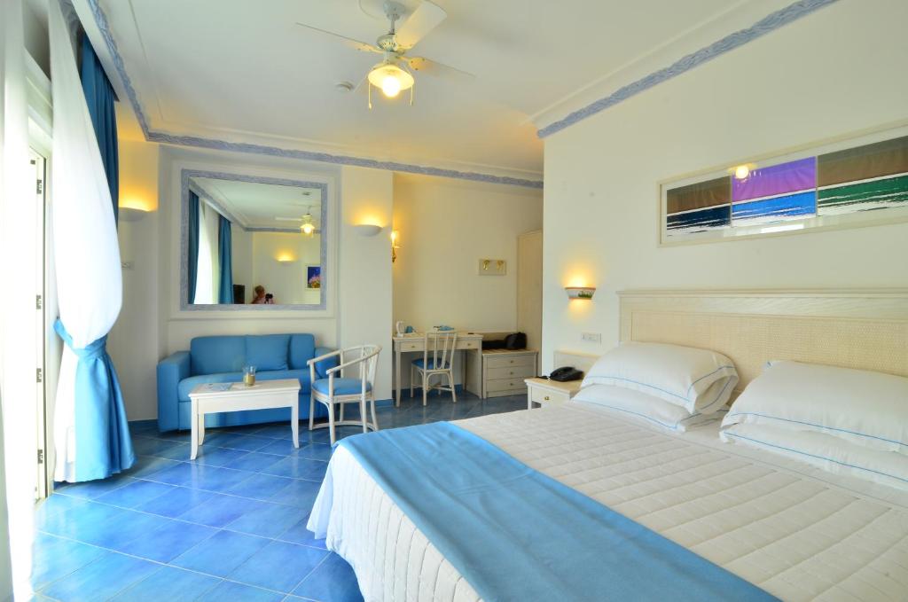 Postel nebo postele na pokoji v ubytování Hotel Aurora