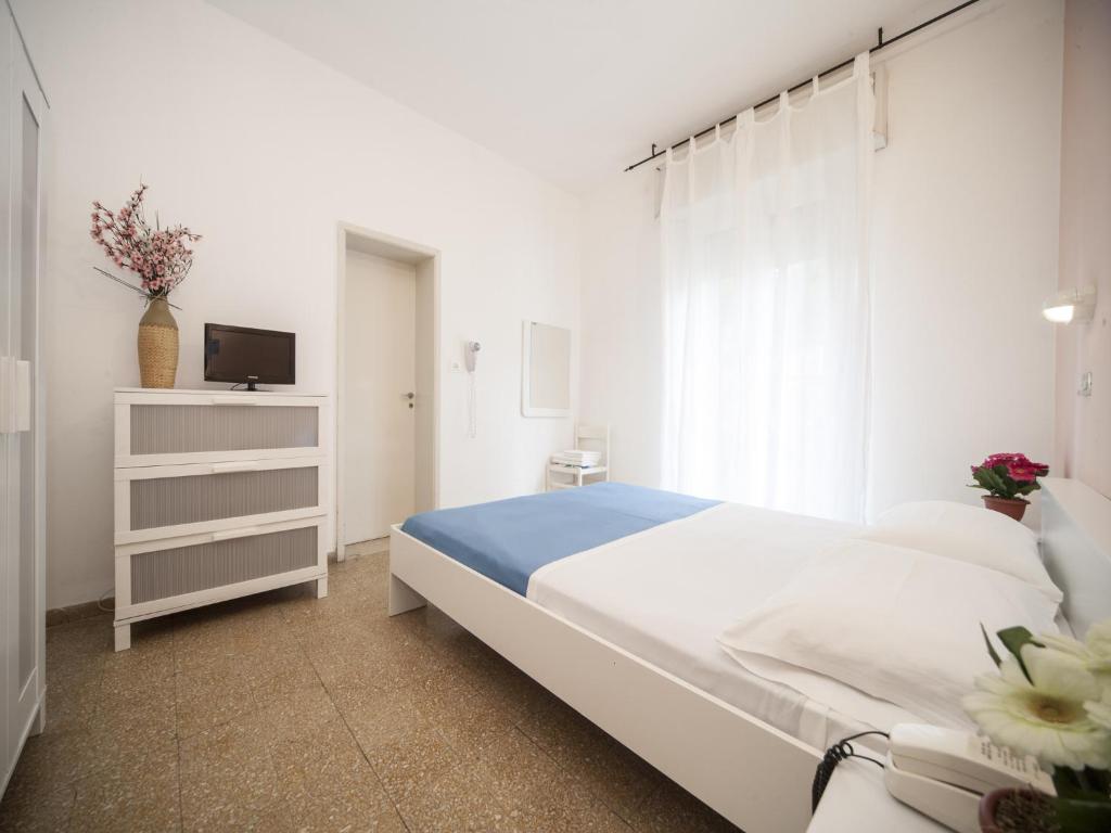 Posteľ alebo postele v izbe v ubytovaní Hotel Colombo