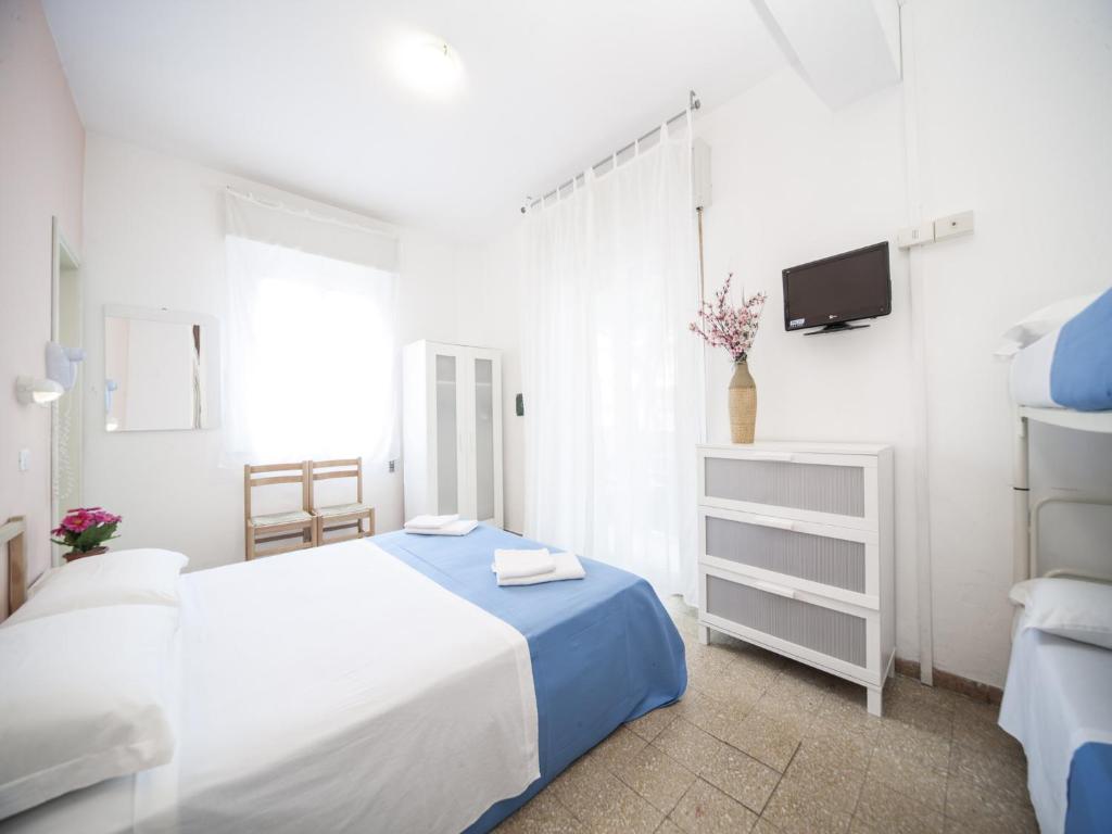 Posteľ alebo postele v izbe v ubytovaní Hotel Colombo