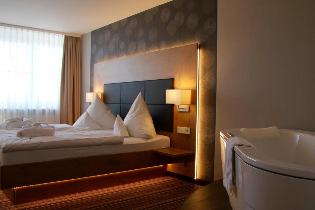 מיטה או מיטות בחדר ב-Hotel Tannhof
