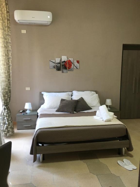Posteľ alebo postele v izbe v ubytovaní Soggiorno Paradiso