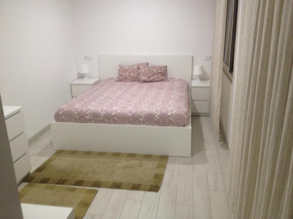 Postel nebo postele na pokoji v ubytování casa das pombas