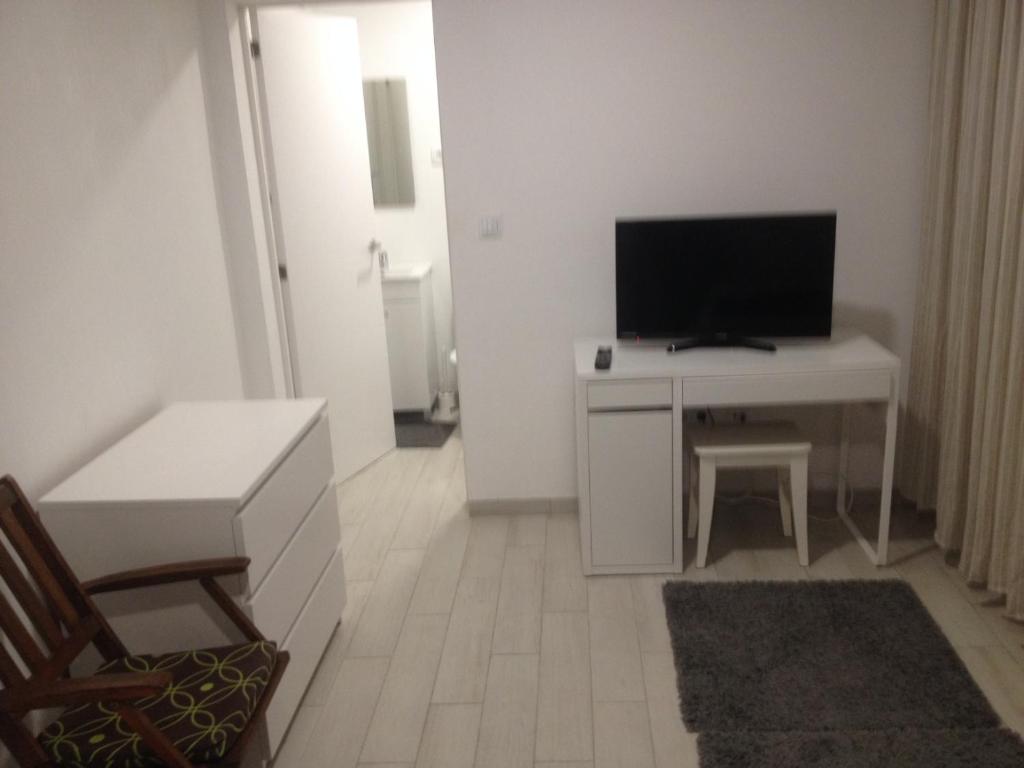 TV a/nebo společenská místnost v ubytování casa das pombas