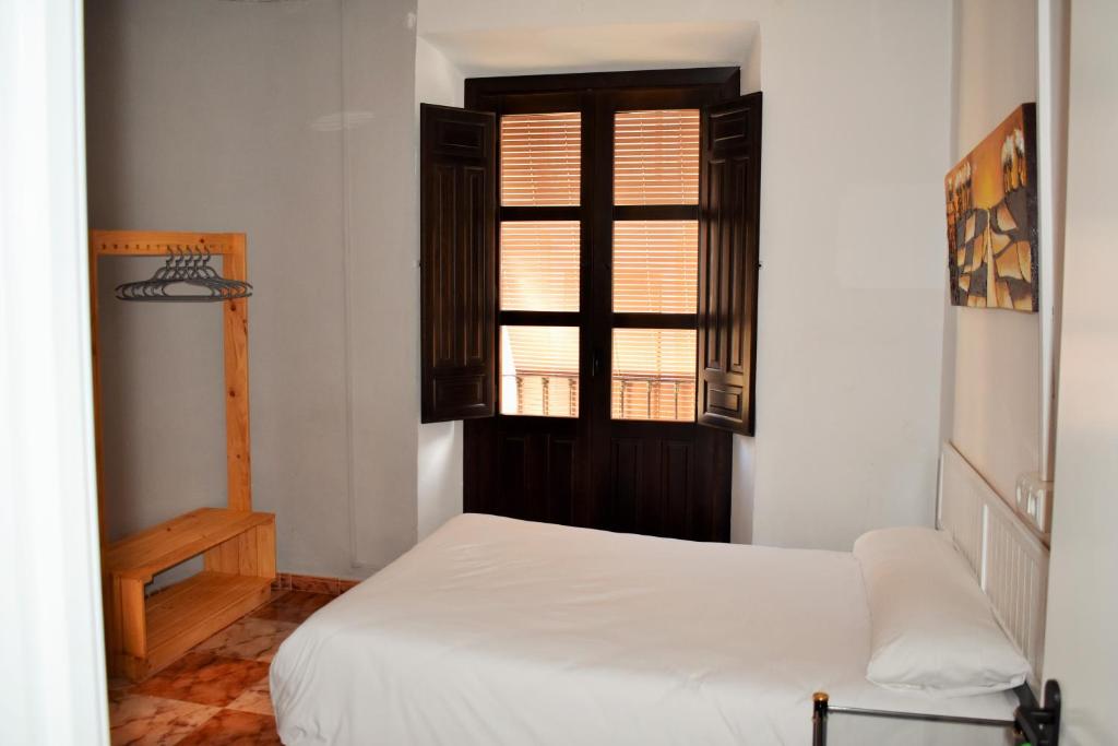 Cama o camas de una habitación en Pension Castil