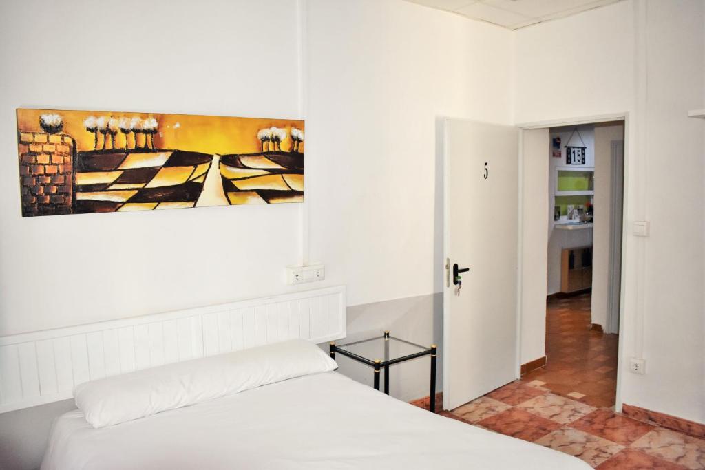 Cama o camas de una habitación en Pension Castil