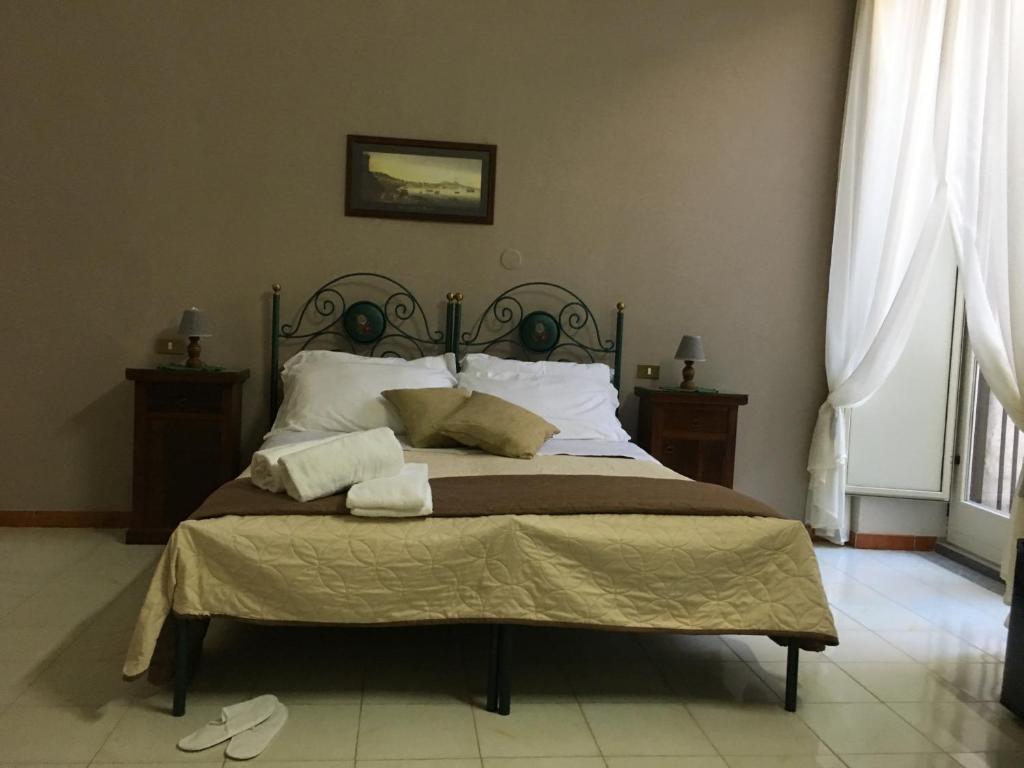Posteľ alebo postele v izbe v ubytovaní Soggiorno Paradiso