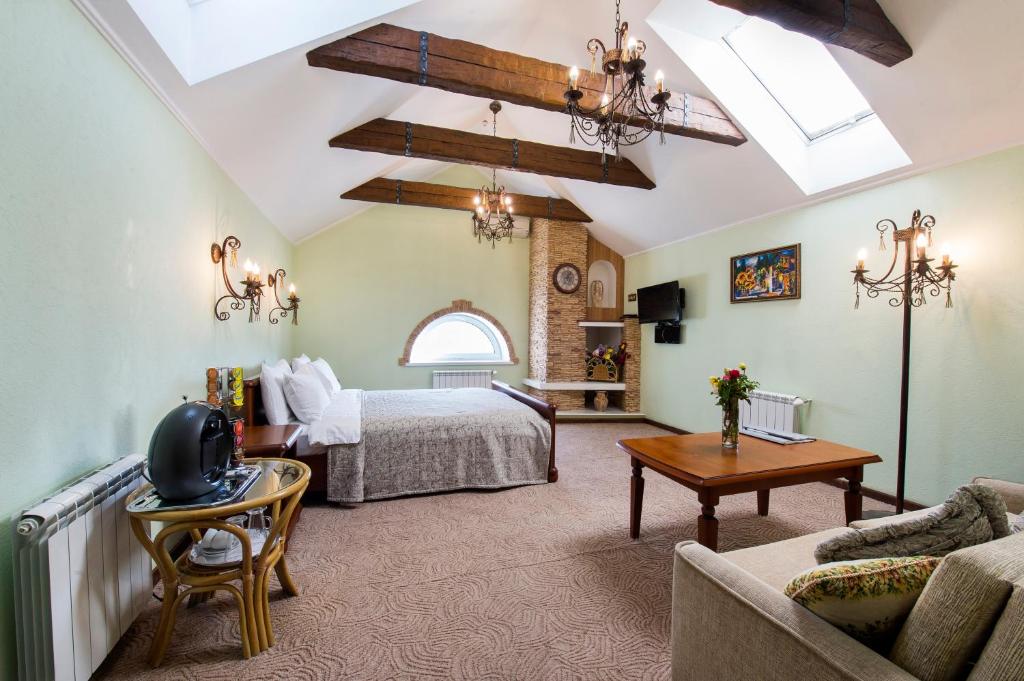 Postel nebo postele na pokoji v ubytování Oselya Hotel