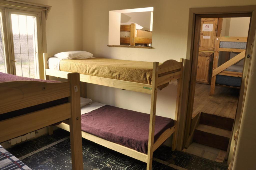 Postel nebo postele na pokoji v ubytování HOPA-Home Patagonia Hostel & Bar
