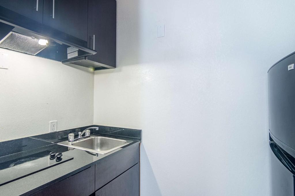 a kitchen with a sink and a counter top at Motel 6-Ardmore, OK in Ardmore