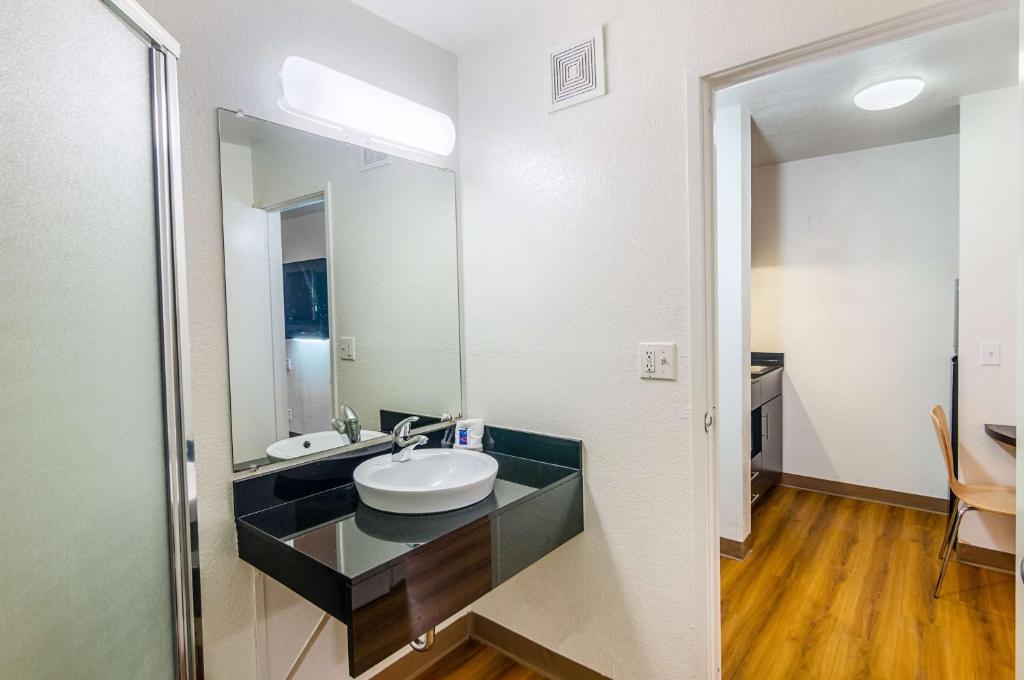 a bathroom with a sink and a mirror at Motel 6-Ardmore, OK in Ardmore