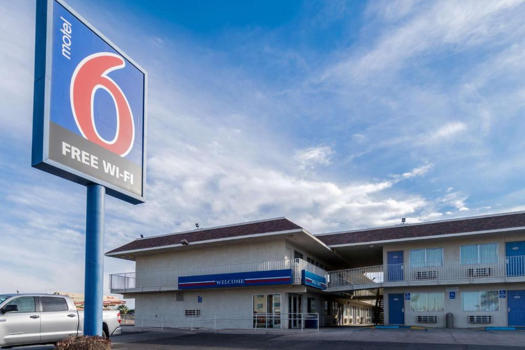 a free wifi sign in front of a building at Motel 6-El Centro, CA in El Centro