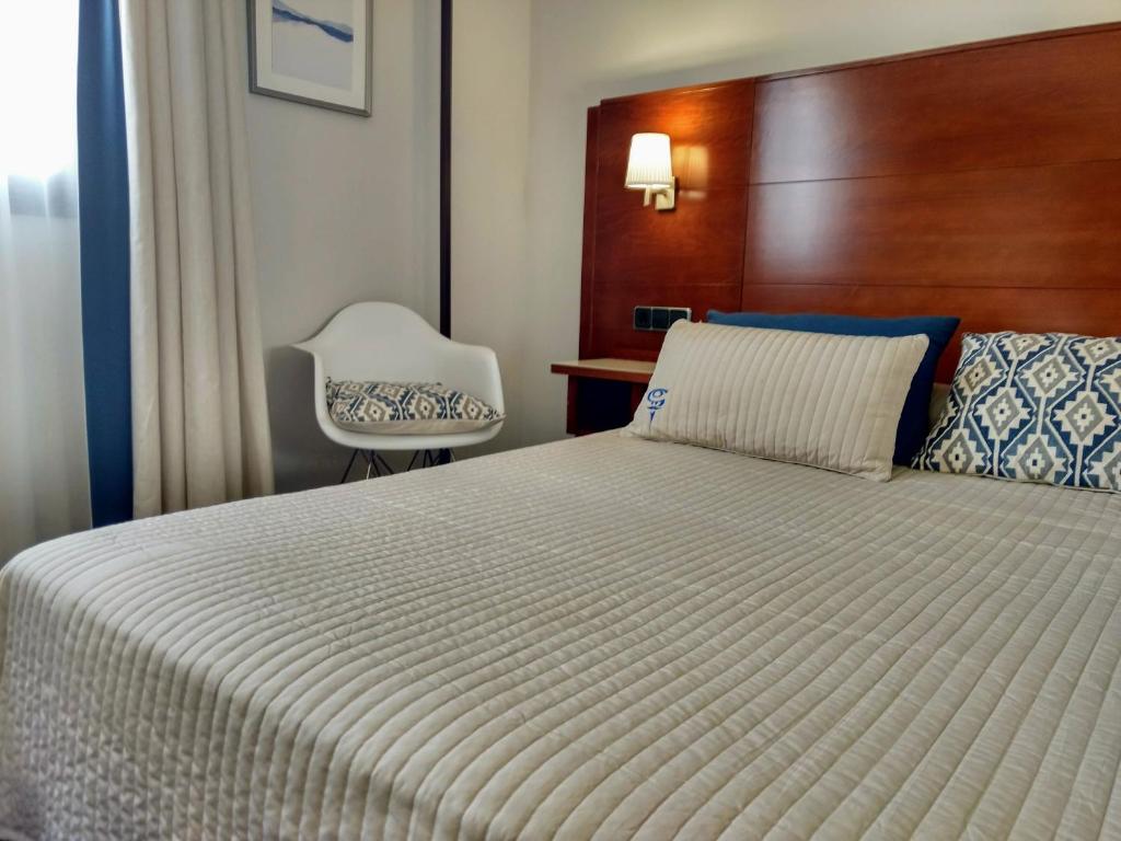 Postel nebo postele na pokoji v ubytování Hotel Hidalgo