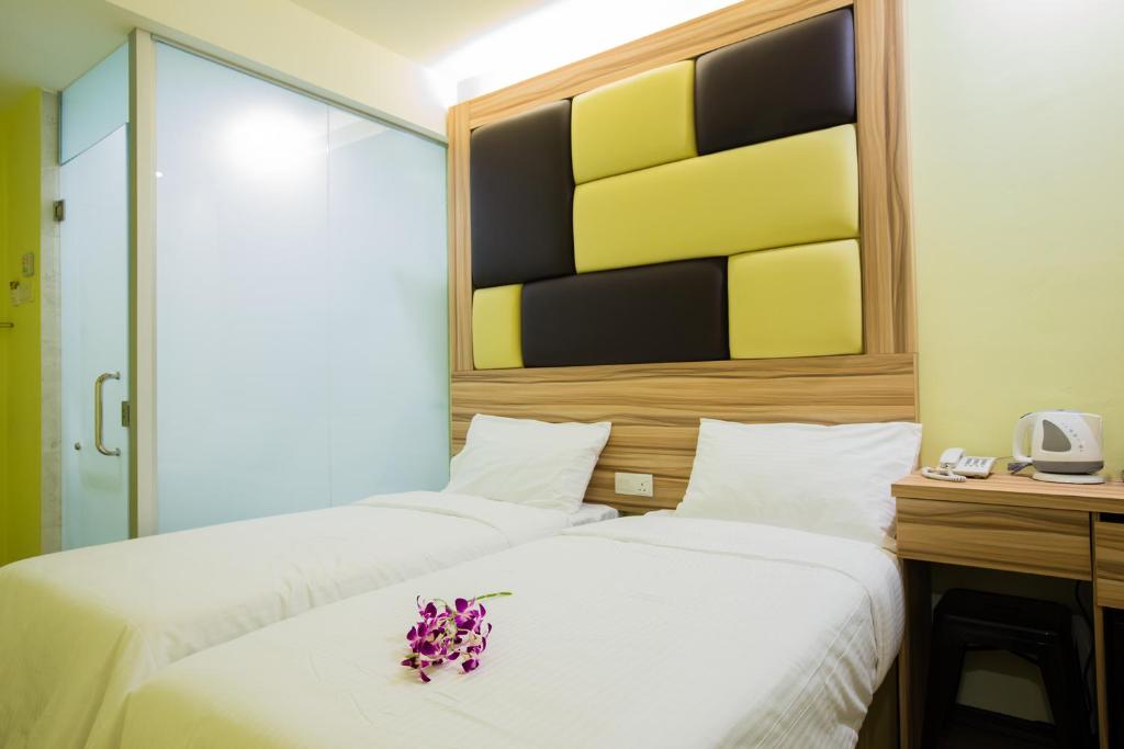 Postel nebo postele na pokoji v ubytování Hotel CIQ @ Wong Ah Fook