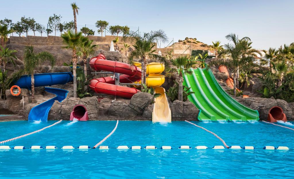 a water slide in a pool at a water park at Globales Los Patos Park in Benalmádena