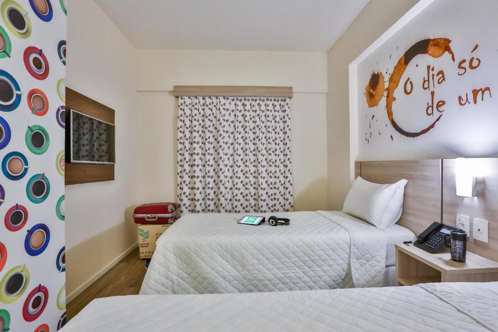 Postel nebo postele na pokoji v ubytování ibis Styles Vitoria da Conquista