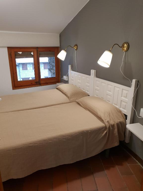 Postel nebo postele na pokoji v ubytování Apartaments Can Bundanci