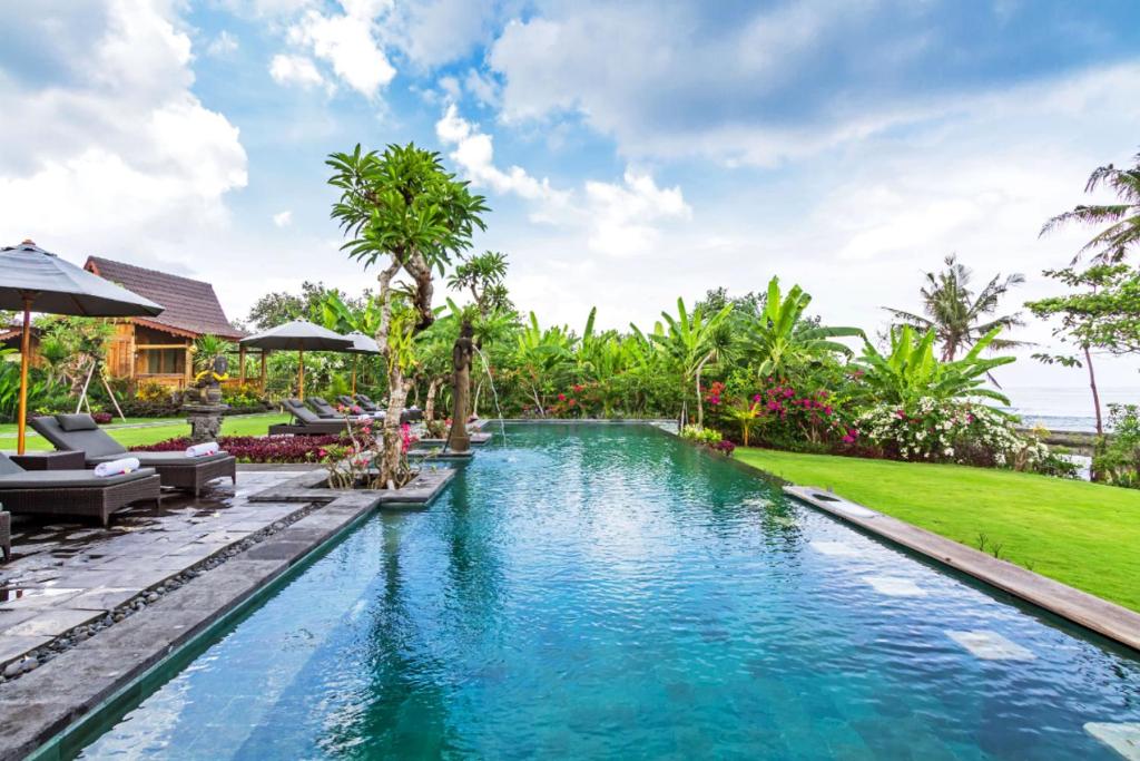 an image of a swimming pool at a villa at Bali Natha Beach Front in Canggu