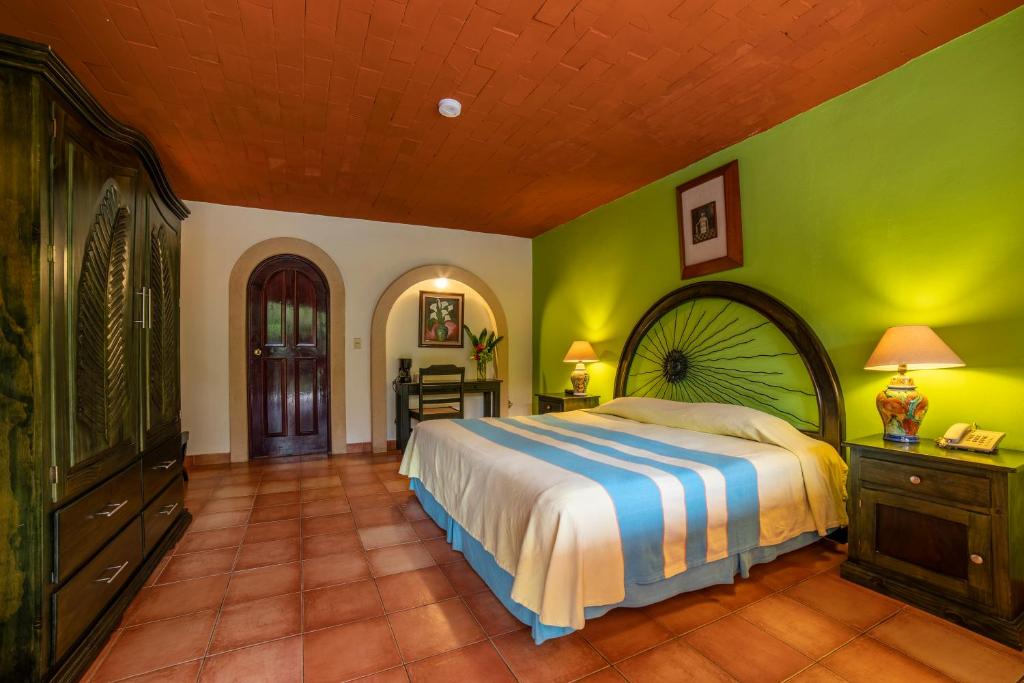 Llit o llits en una habitació de Hotel Chichen Itza