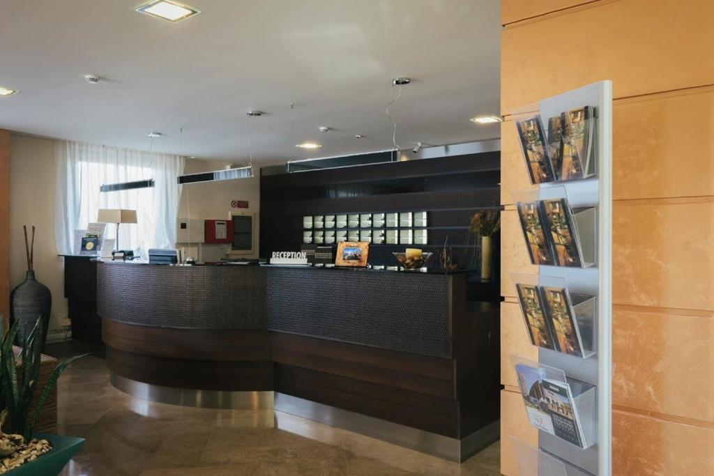 a lobby with a bar in a hotel room at Hotel Costa Azul in Balestrate