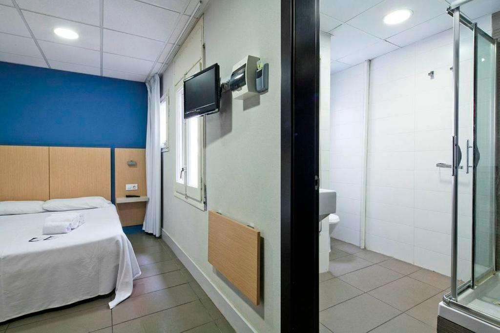 Postel nebo postele na pokoji v ubytování Putxet by gaiarooms