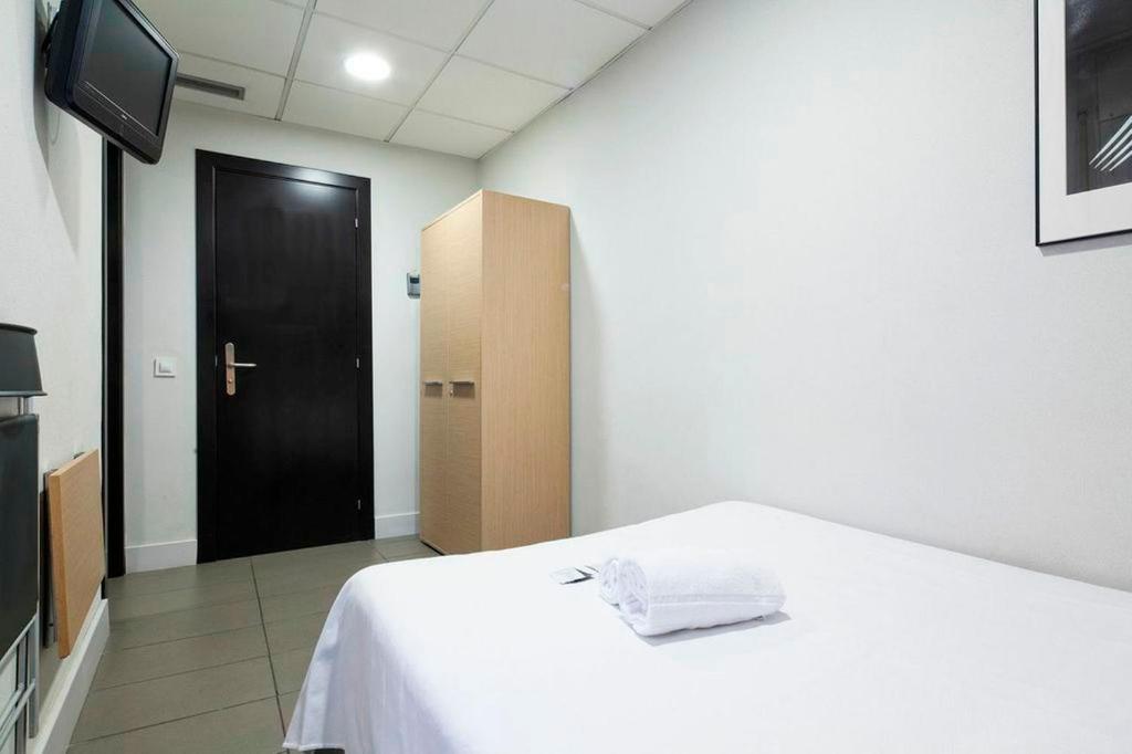 Postel nebo postele na pokoji v ubytování Putxet by gaiarooms