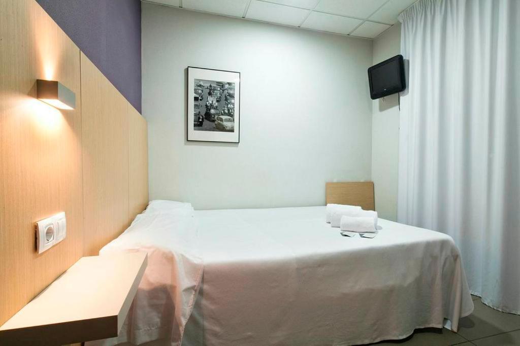 Postel nebo postele na pokoji v ubytování Putxet by gaiarooms