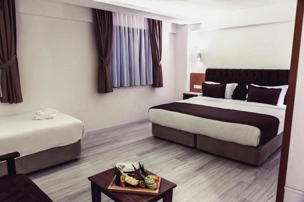 Postel nebo postele na pokoji v ubytování Tymbris Hotel Eskisehir