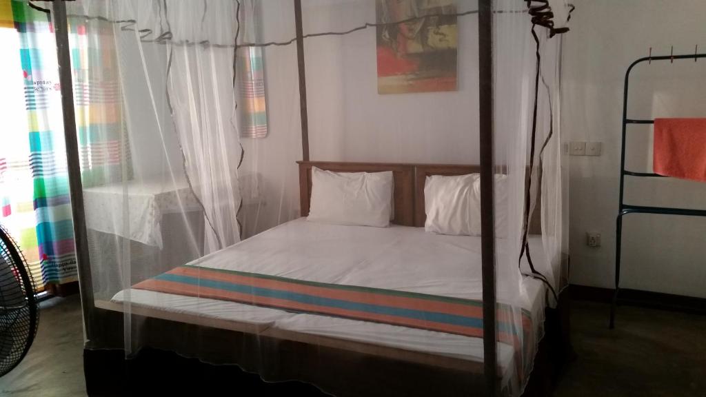 Кровать или кровати в номере Chelli Homestay