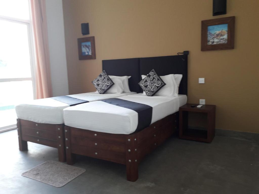 Postel nebo postele na pokoji v ubytování Nil Diya Beach Resort