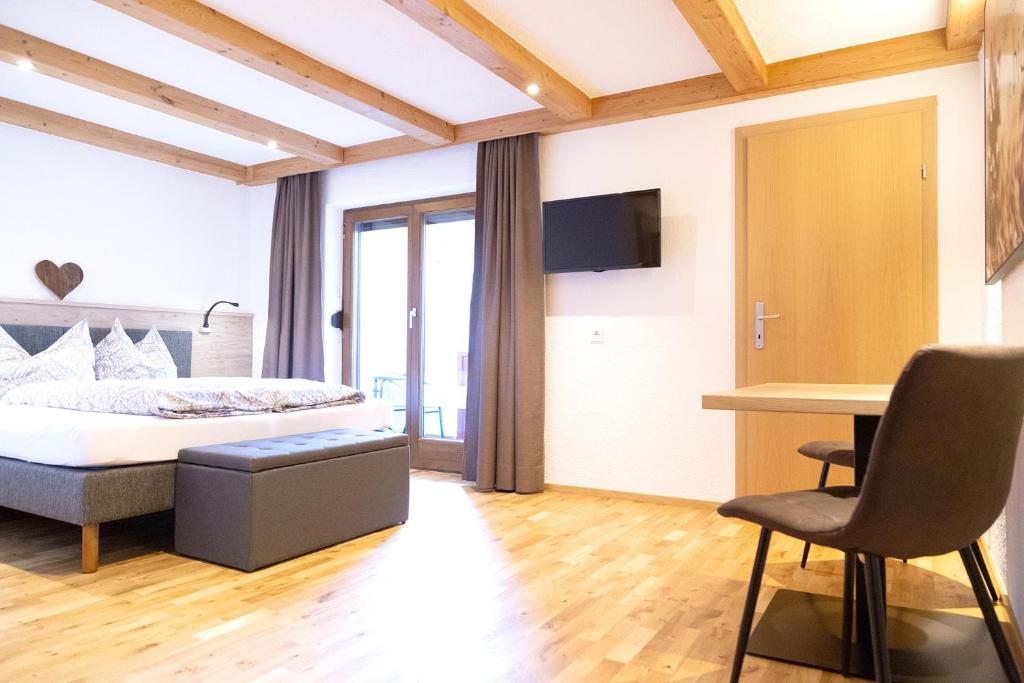 Postel nebo postele na pokoji v ubytování Haus Steinbock