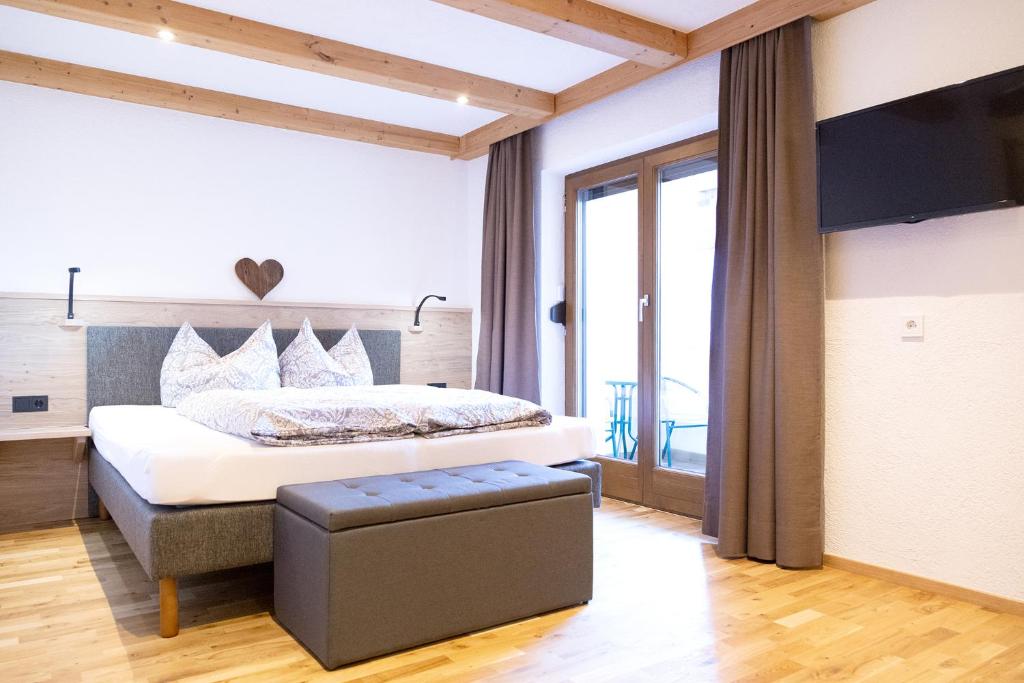 Postel nebo postele na pokoji v ubytování Haus Steinbock