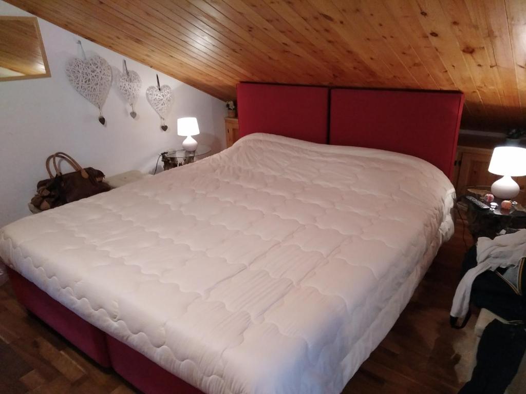 Łóżko lub łóżka w pokoju w obiekcie Condominio Esagono