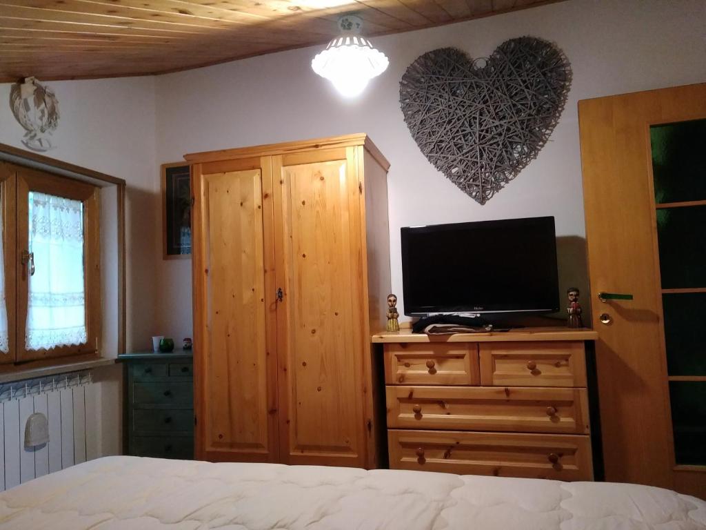 Telewizja i/lub zestaw kina domowego w obiekcie Condominio Esagono