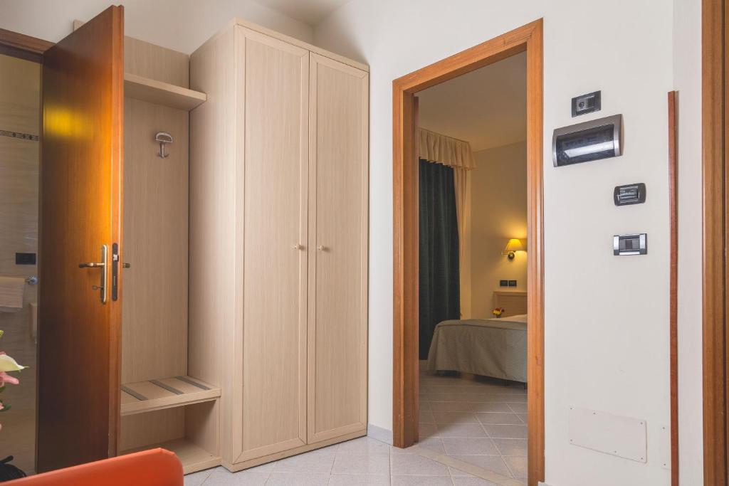 Postel nebo postele na pokoji v ubytování Hotel Bixio