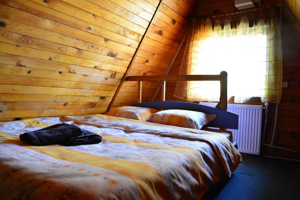 A bed or beds in a room at Borovets Gondola Apartment & Ski by Winter Bros