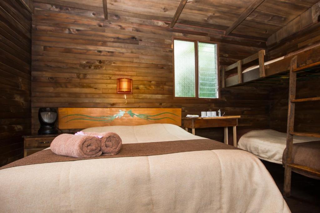 Postel nebo postele na pokoji v ubytování Paraíso Quetzal Lodge
