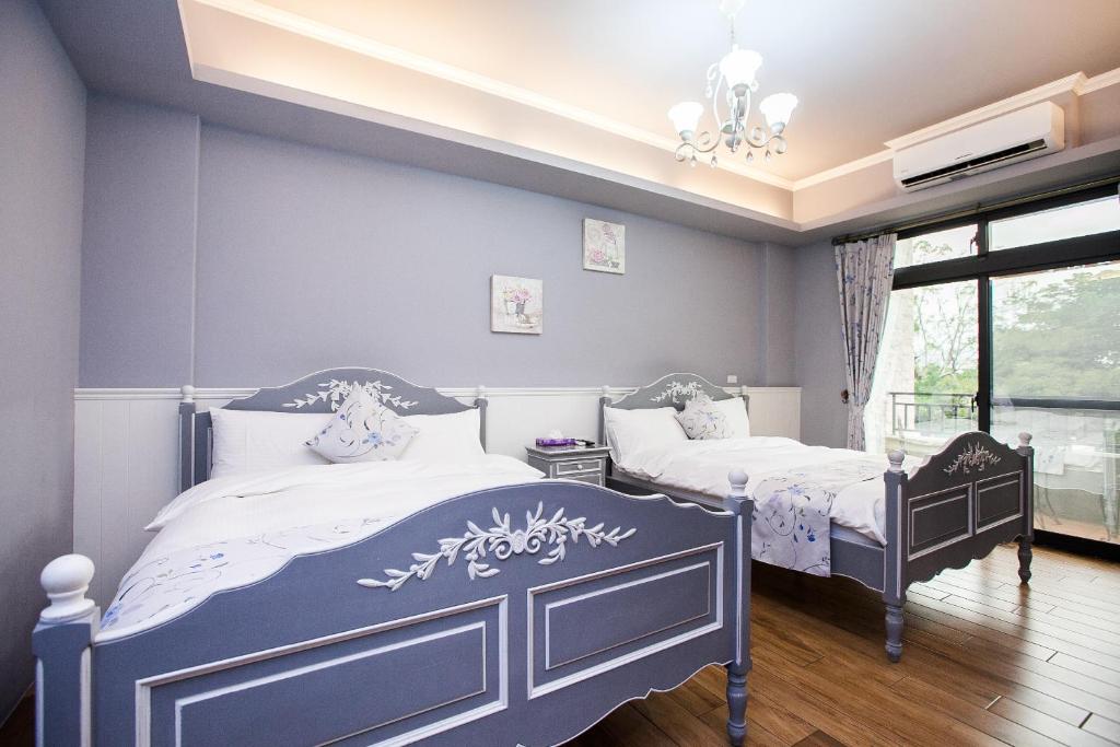 Postel nebo postele na pokoji v ubytování Iris Guest House