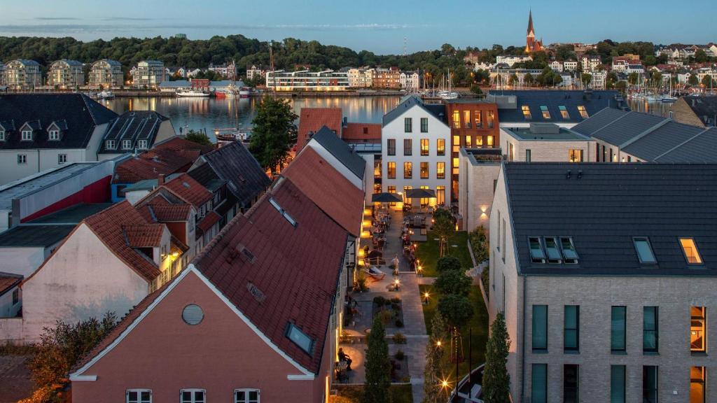an overhead view of a city with a river and buildings at Hotel Hafen Flensburg in Flensburg