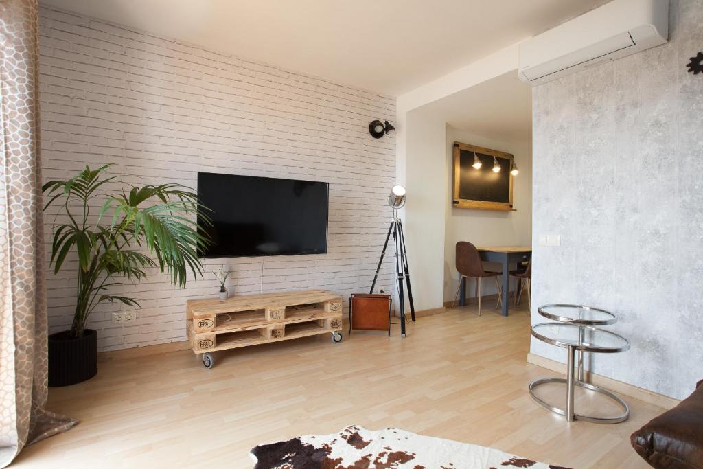 Telewizja i/lub zestaw kina domowego w obiekcie Apartment Beach Front Canet