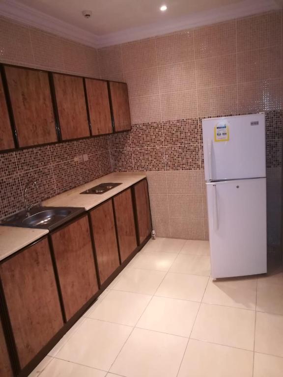 Kuchyň nebo kuchyňský kout v ubytování Leen Serviced Apartments