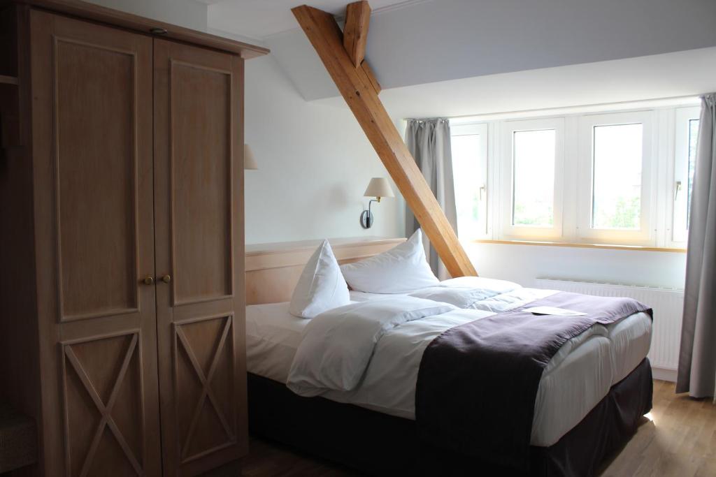 Postel nebo postele na pokoji v ubytování BE BIO Hotel be active - Nähe historischer Hafen