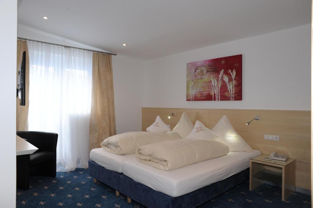 Postel nebo postele na pokoji v ubytování Hotel-Restaurant Steuermann