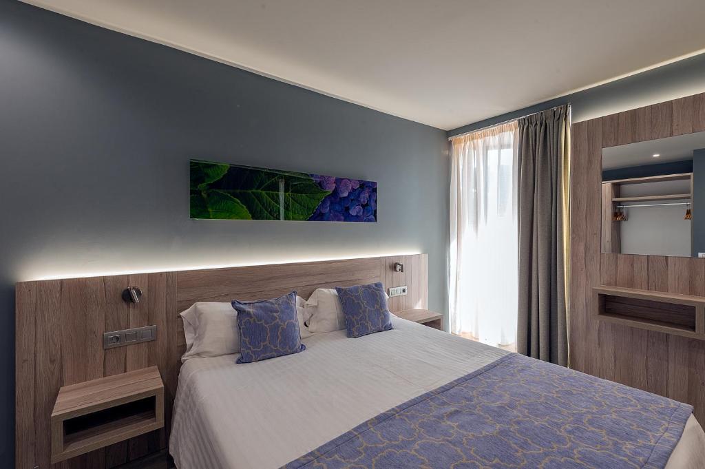 Postel nebo postele na pokoji v ubytování Apartamentos NataLis