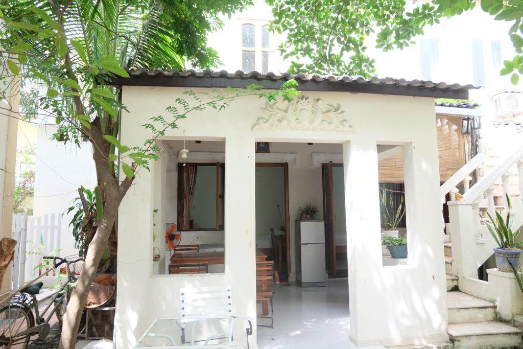 a small house with a white facade at Moon house tropical garden - East side in Nha Trang