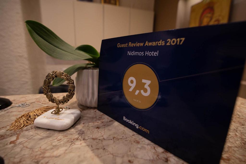 Certifikát, hodnocení, plakát nebo jiný dokument vystavený v ubytování Nidimos Hotel