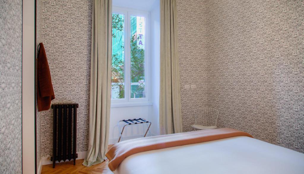 Posteľ alebo postele v izbe v ubytovaní App Beccaria Apartments in Rome